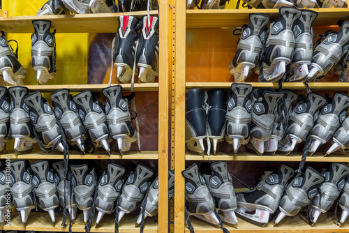 Closet with shelves full of ice skates for rent