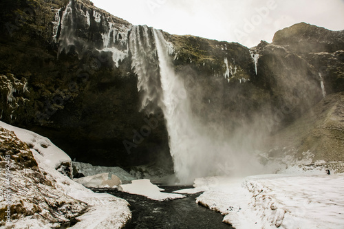 Winter landscape in Seljalandsfoss waterfall, Iceland, Northern Europe