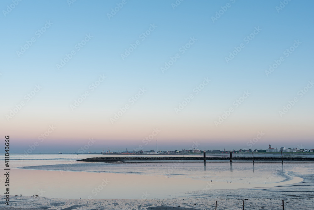 Wadden Sea with city silhouette of Cuxhaven
