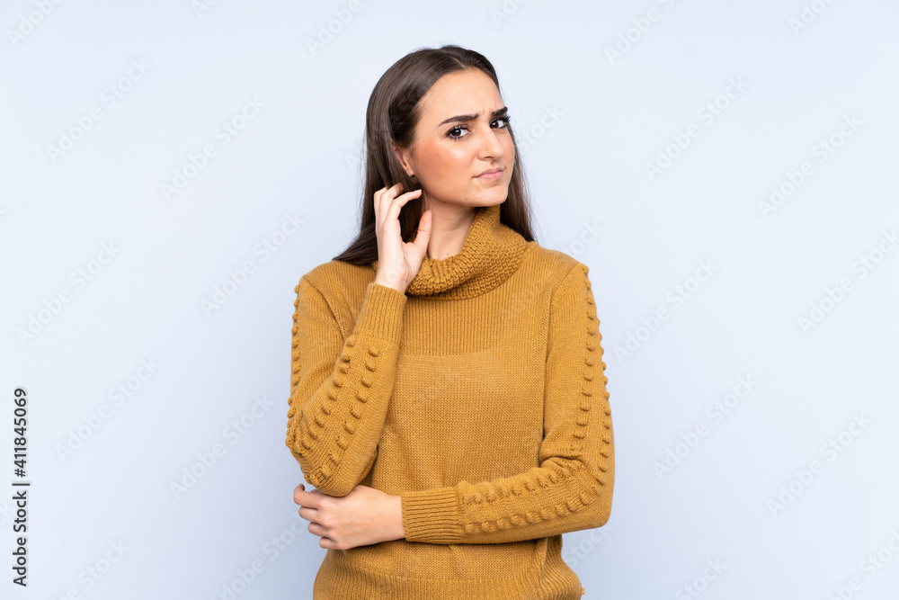 Young caucasian woman isolated on blue background having doubts Young caucasian woman isolated on blue background having doubts