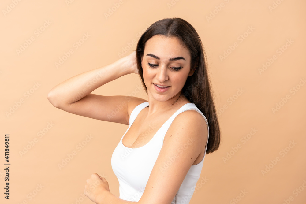 Obraz premium Young caucasian woman isolated on beige background . Portrait