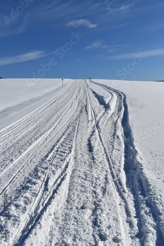  A snowmobile trail under a blue sky, Québec © Claude Laprise