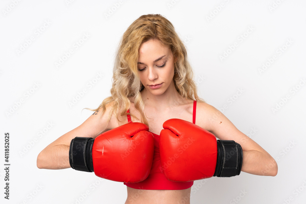 Young blonde woman isolated on white background with boxing gloves Young blonde woman isolated on white background with boxing gloves