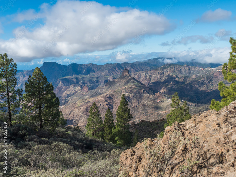 Amazing view from Roque Nublo plateau on central volcanic mountains with Caldera and Barranco de Tejeda and Roque Bentayg rock. Gran Canaria, Canary Islands, Spain.