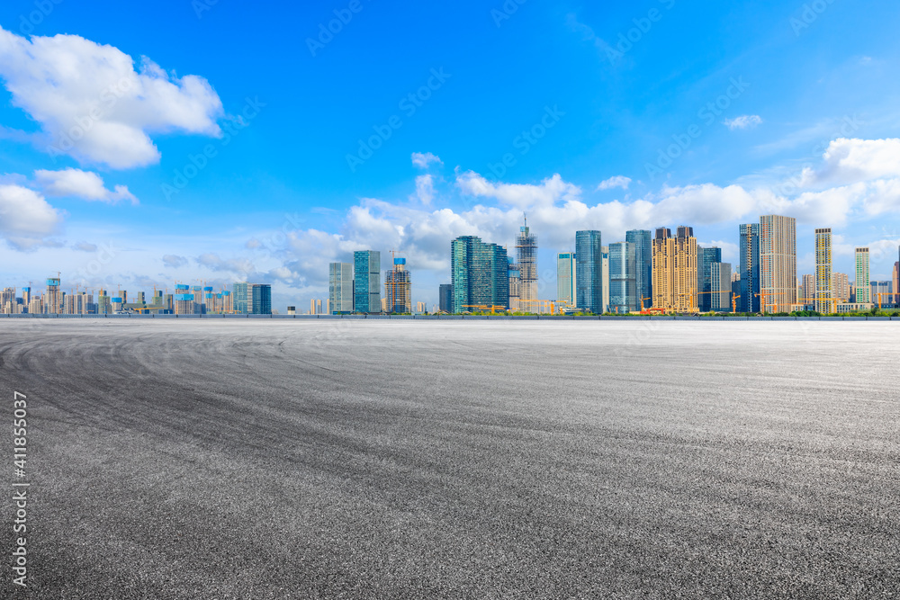 Race track road and modern city skyline with buildings in Hangzhou. Race track road and modern city skyline with buildings in Hangzhou.