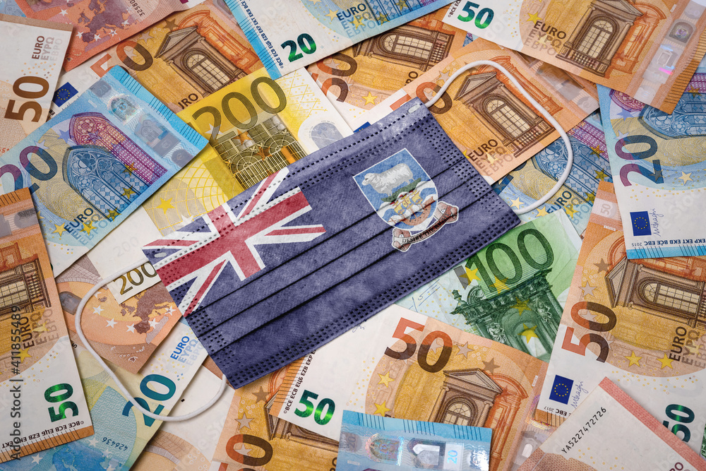 Medical mask with the flag of Falkland Islands on a variety of european banknotes.(series) Medical mask with the flag of Falkland Islands on a variety of european banknotes.(series)
