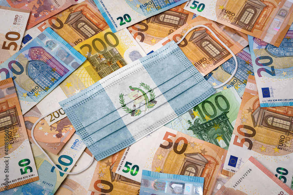 Medical mask with the flag of Guatemala on a variety of european banknotes.(series) Medical mask with the flag of Guatemala on a variety of european banknotes.(series)