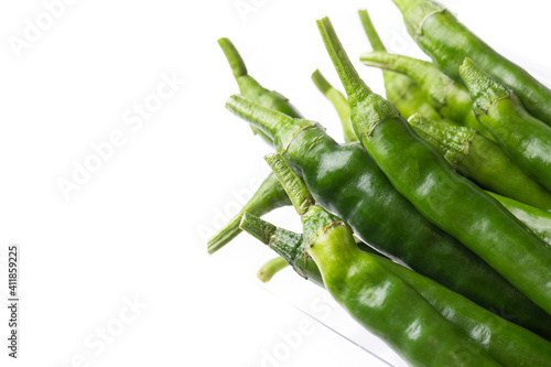 Green hot pepper on a white...