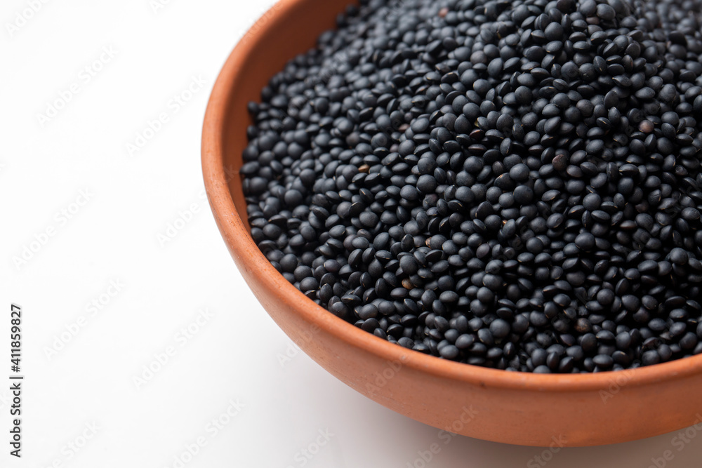 Black beluga lentils on the white background Black beluga lentils on the white background