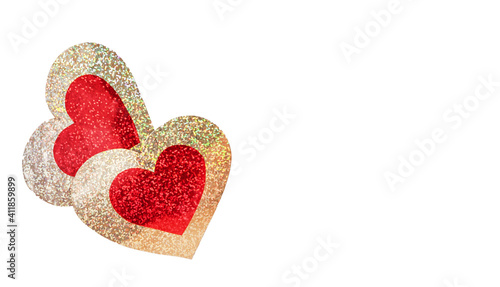 Two red-gold shiny hearts on a white background. Valentine s Day concept.