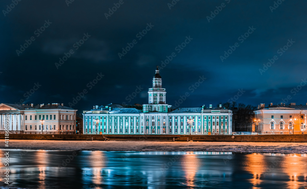 Kunstkammer or Kunstkamera Museum on the Vasilevskiy Island from across the Neva River in Saint Petersburg. City at winter night