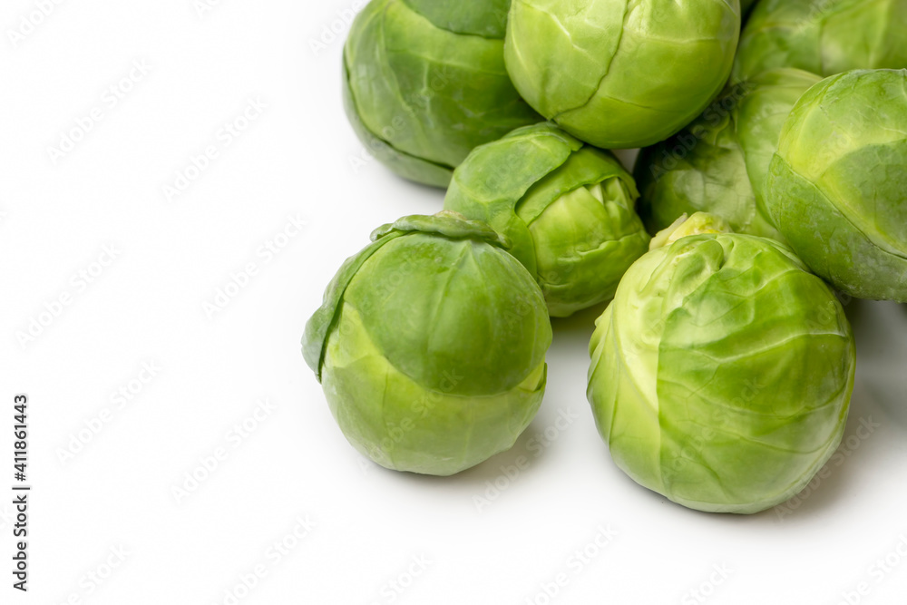 Fototapeta premium Green fresh brussels sprouts on the white background