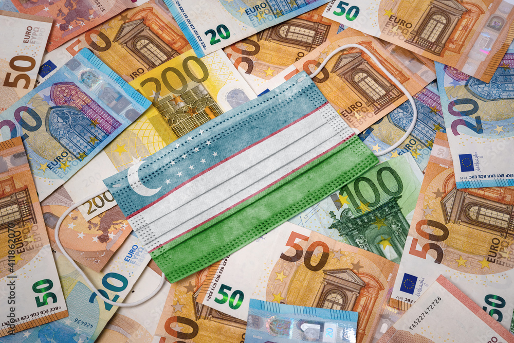 Medical mask with the flag of Uzbekistan on a variety of european banknotes.(series) Medical mask with the flag of Uzbekistan on a variety of european banknotes.(series)