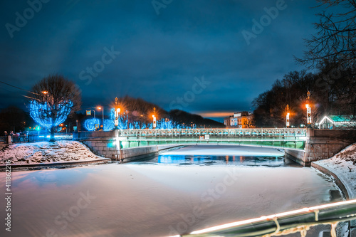 View of the Second Sadovy Bridge in winter St. Petersburg. Holiday illumination in the city.