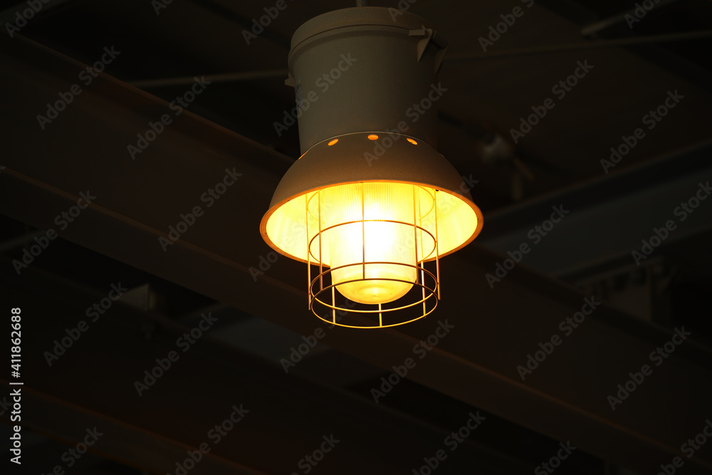 a hanging bright yellow bulb