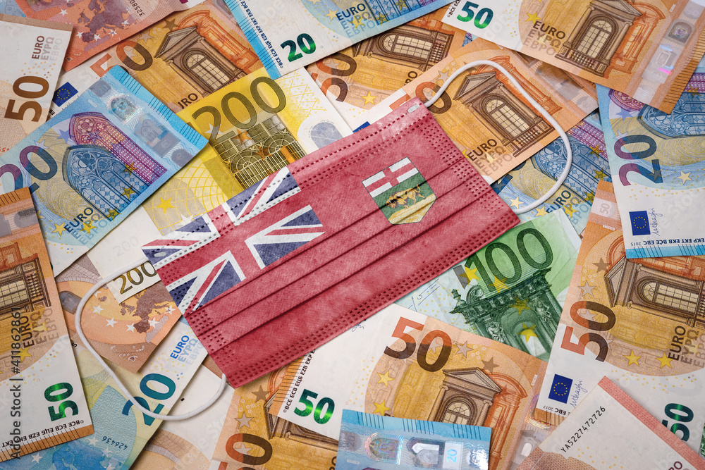Medical mask with the flag of Manitoba on a variety of european banknotes.(series) Medical mask with the flag of Manitoba on a variety of european banknotes.(series)