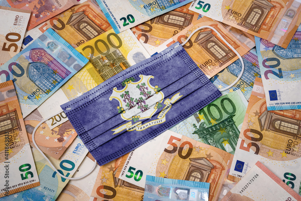 Medical mask with the flag of Connecticut on a variety of european banknotes.(series) Medical mask with the flag of Connecticut on a variety of european banknotes.(series)