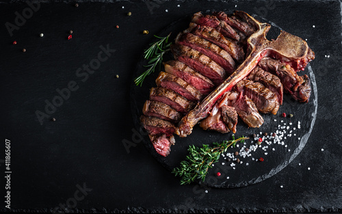 Panorama banner with sliced steak medium rare, dry aged wagyu porterhouse beef steak with large fillet piece, Restaurant menu, dieting, cookbook recipe, place for text, top view