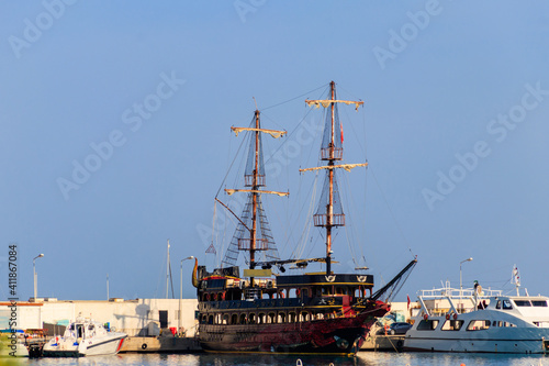 Stylized pirate yacht in marina harbor in Kemer, Turkey