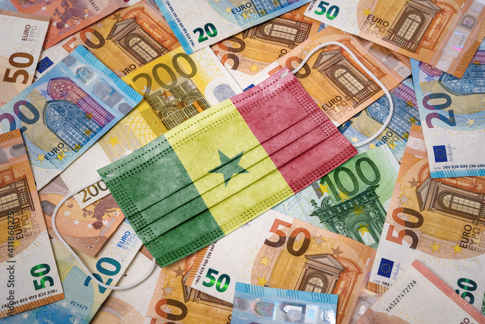 Medical mask with the flag of Senegal on a variety of european banknotes.(series)