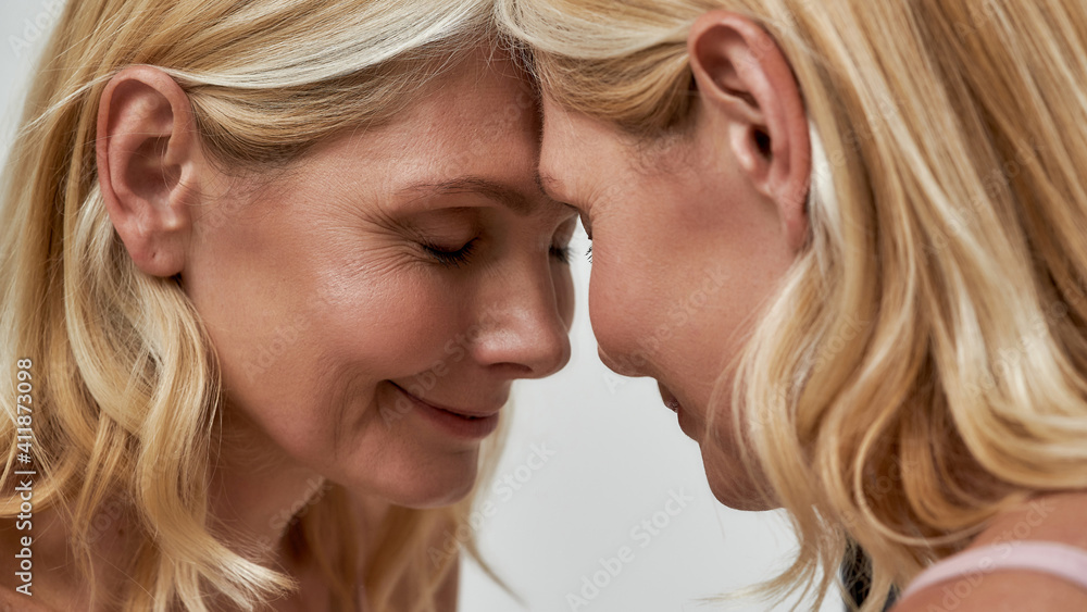 Portrait of middle aged caucasian woman near mirror Portrait of middle aged caucasian woman near mirror