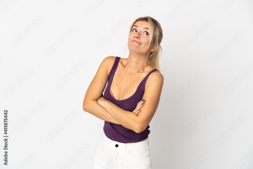 Young Russian woman isolated on white background making doubts gesture while lifting the shoulders Young Russian woman isolated on white background making doubts gesture while lifting the shoulders