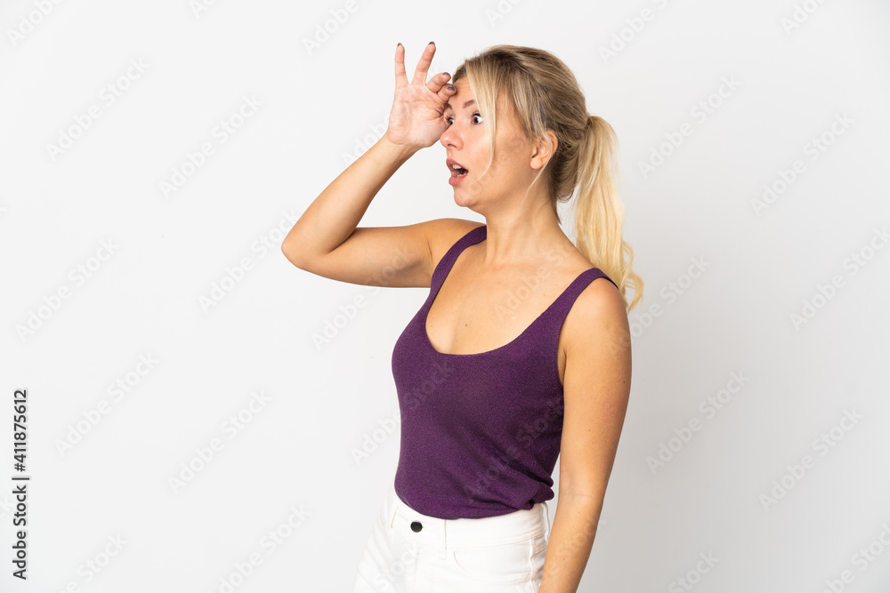Young Russian woman isolated on white background with surprise expression while looking side Young Russian woman isolated on white background with surprise expression while looking side