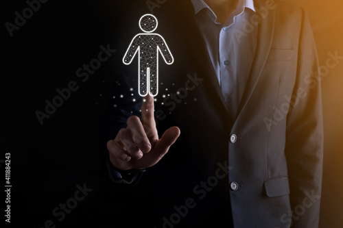 Businessman holds man person icon on dark tone background.HR Human ,people iconTechnology Process System Business with Recruitment, Hiring, Team Building. Organisation structure concept photo