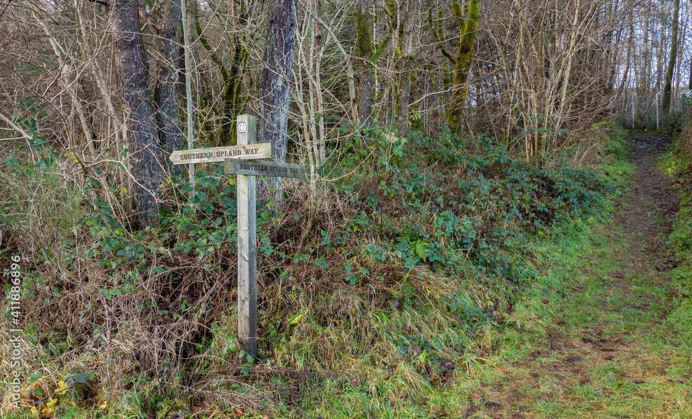 Wooden sign post for the Southern Uplands way path in Galloway, Scotland Wooden sign post for the Southern Uplands way path in Galloway, Scotland