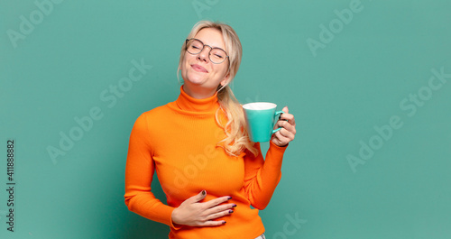blonde pretty woman with a coffee or tea cup