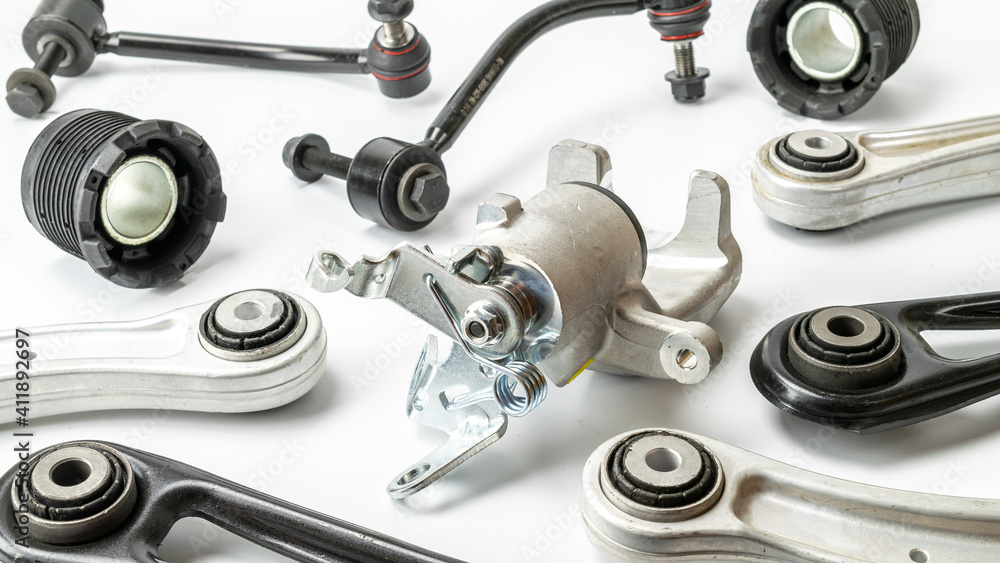 Car inspection. Auto motor mechanic spare or automotive piece on white background. Set of new metal car part. Automobile engine service. Car inspection. Auto motor mechanic spare or automotive piece on white background. Set of new metal car part. Automobile engine service.