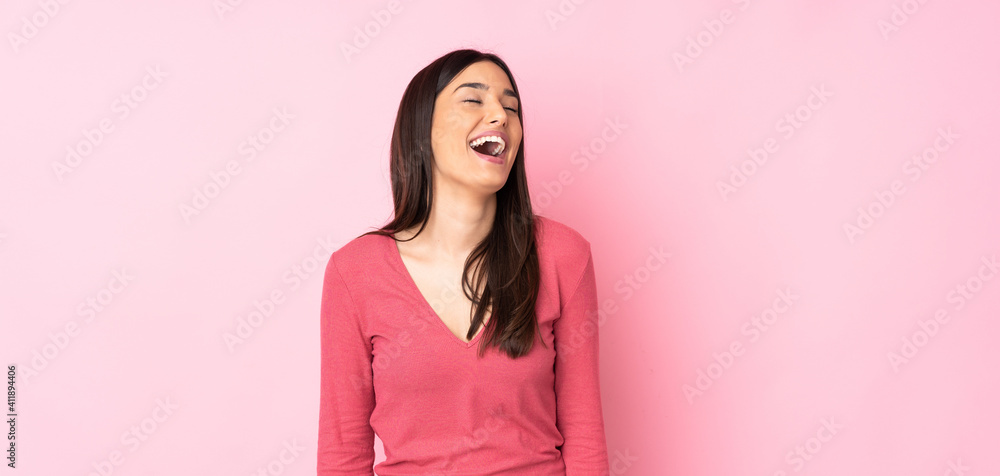 Young caucasian woman over isolated background laughing Young caucasian woman over isolated background laughing