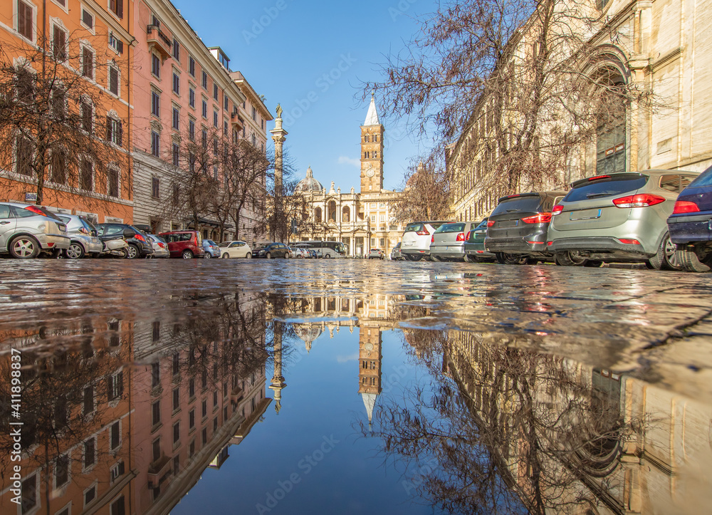 Rome, Italy - in Winter time, frequent rain showers create pools in which the wonderful Old Town of Rome reflects like in a mirror. Here in particular Santa Maria Maggiore