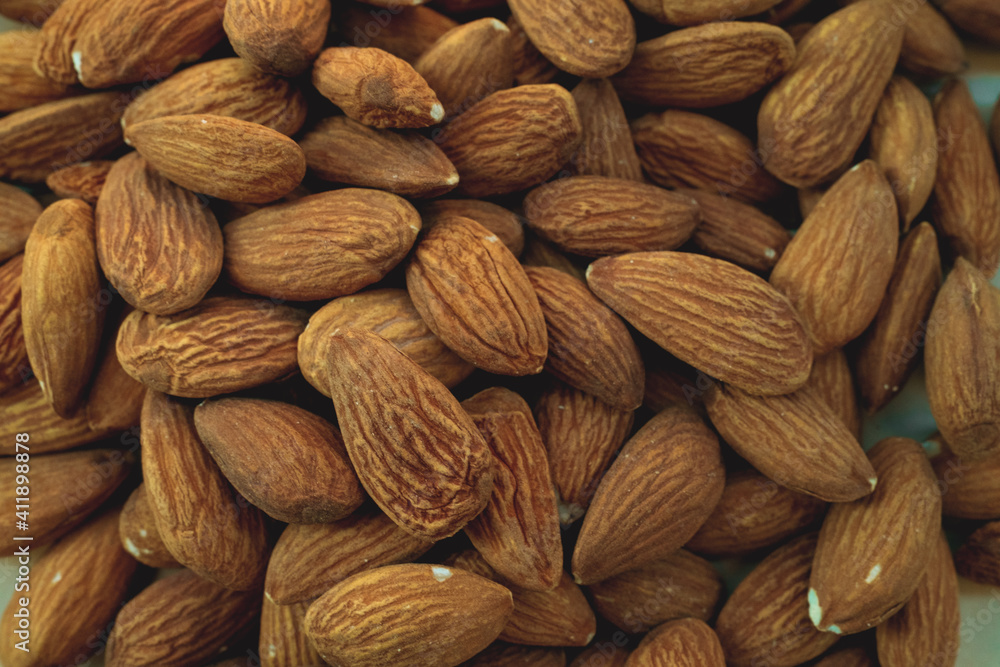 Fototapeta premium Peeled almonds closeup. For vegetarians.