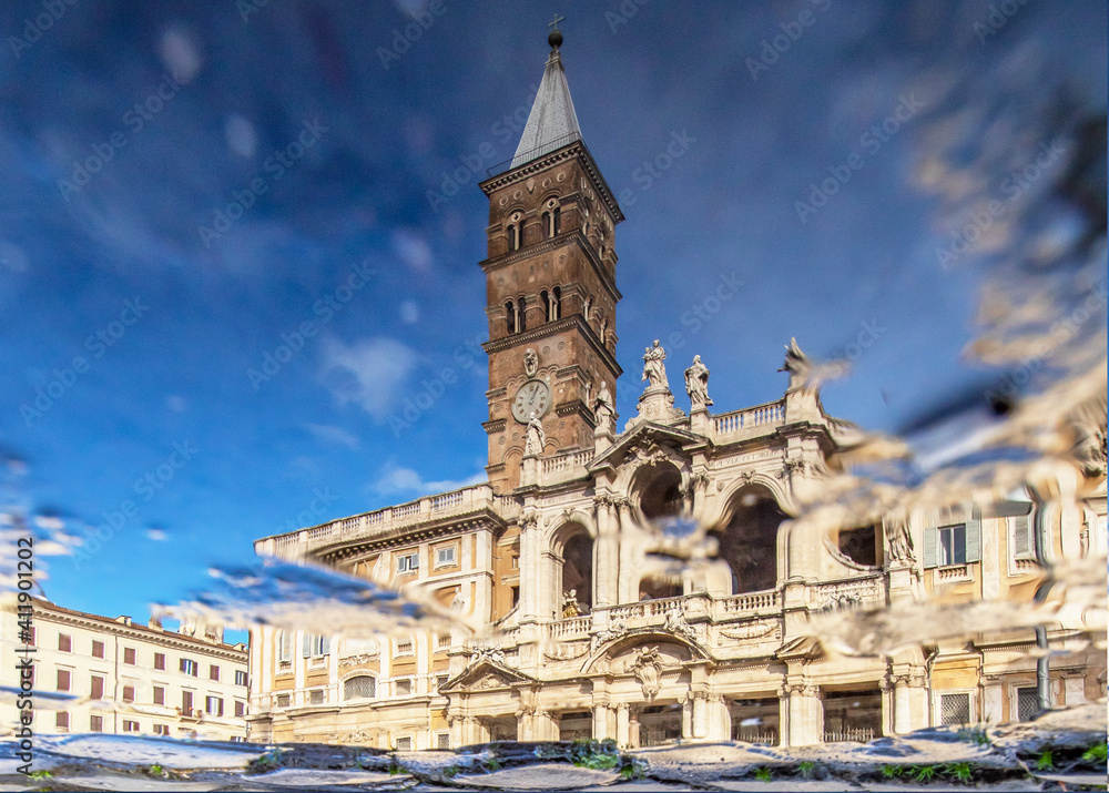 
Rome, Italy - in Winter time, frequent rain showers create pools in which the wonderful Old Town of Rome reflects like in a mirror. Here in particular Santa Maria Maggiore