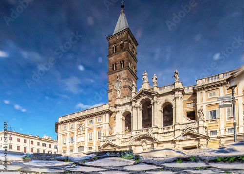  Rome, Italy - in Winter time, frequent rain showers create pools in which the wonderful Old Town of Rome reflects like in a mirror. Here in particular Santa Maria Maggiore