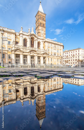  Rome, Italy - in Winter time, frequent rain showers create pools in which the wonderful Old Town of Rome reflects like in a mirror. Here in particular Santa Maria Maggiore