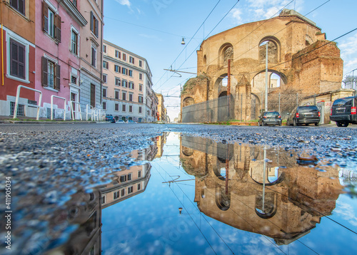 Rome, Italy - in Winter time, frequent rain showers create pools in which the wonderful Old Town of Rome reflects like in a mirror. Here in particular Via Giolitti photo