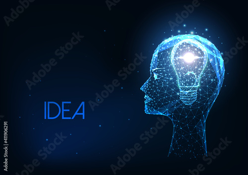 Futuristic creative idea concept with glowing low polygonal human head and light bulb