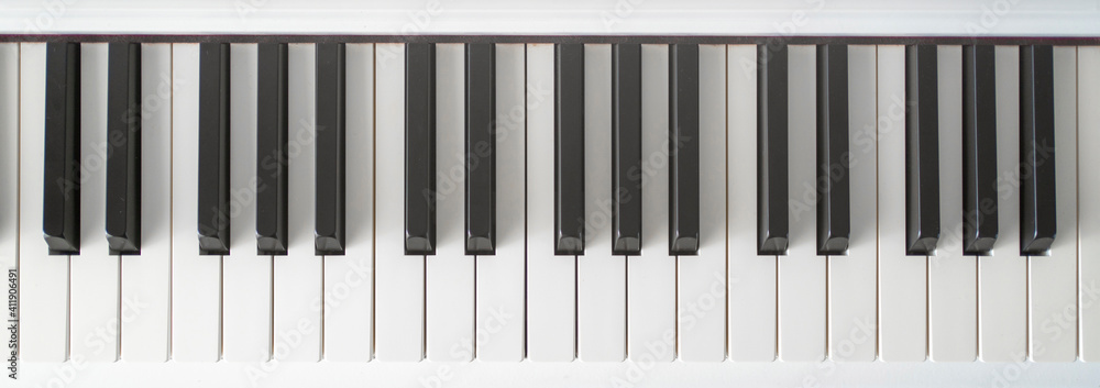 Piano keys from white classic musical digital electronic piano. Learn how to play background Piano keys from white classic musical digital electronic piano. Learn how to play background