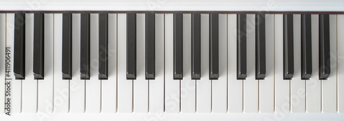 Piano keys from white classic musical digital electronic piano. Learn how to play background