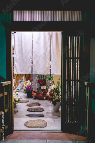 Картината върху платно Traditional entrance at japanese tea house with stones and flowers, Kyoto, Japan