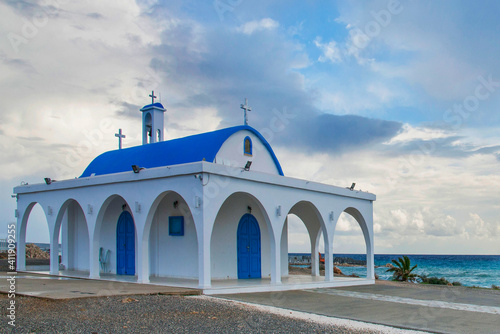St. Thekla (Agia Thekla) church in Agia Napa, Cyprus. The nice view from this white and blue church of St. Thekla (Agia Thekla) on the rocky ledge over sea. Ayia Napa. Cyprus photo