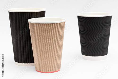 three empty cardboard cups for coffee on a white background