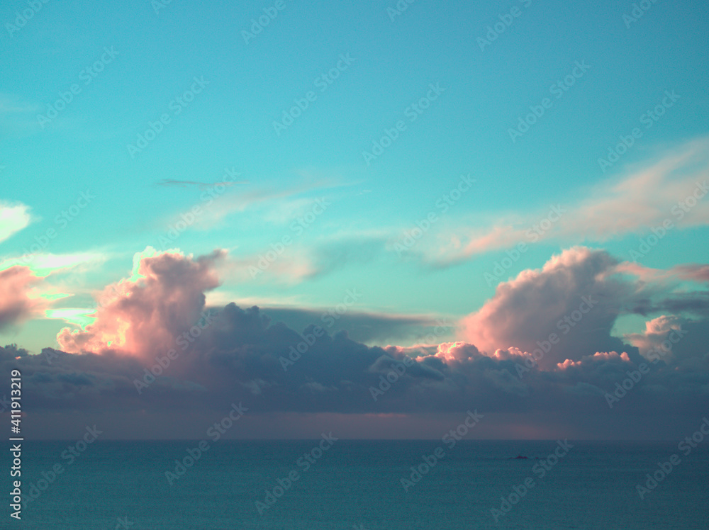 Clouds over the ocean in the sunset sky.
