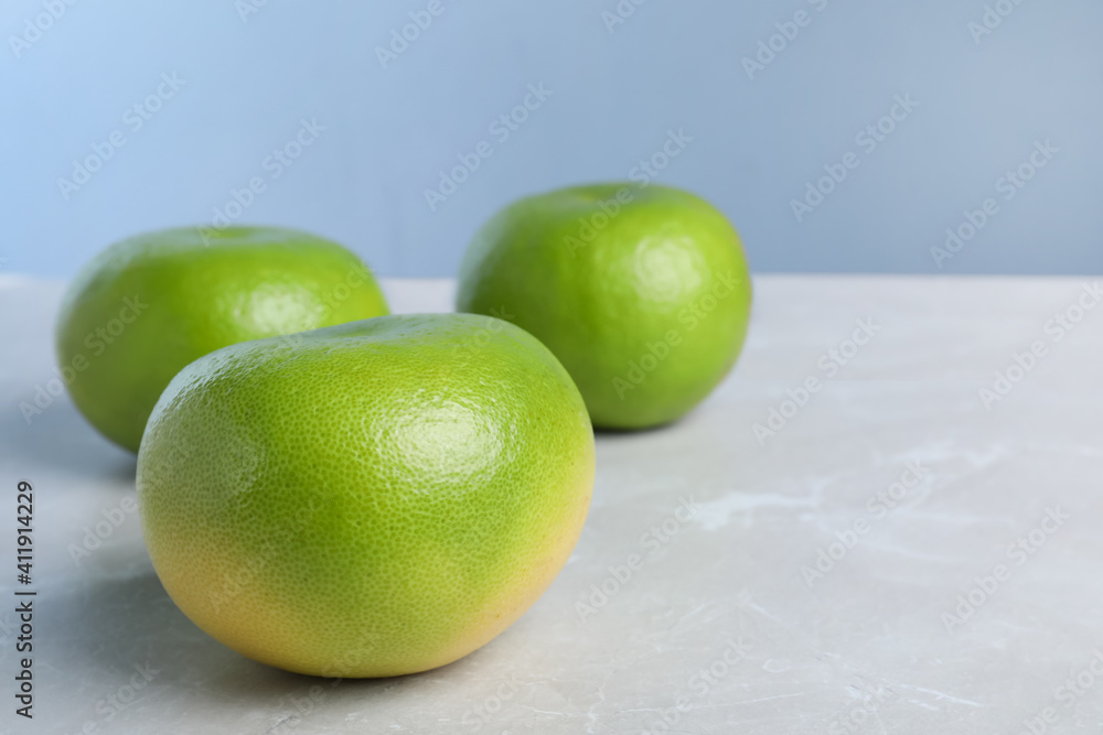 Fresh ripe sweeties on light grey table, space for text Fresh ripe sweeties on light grey table, space for text