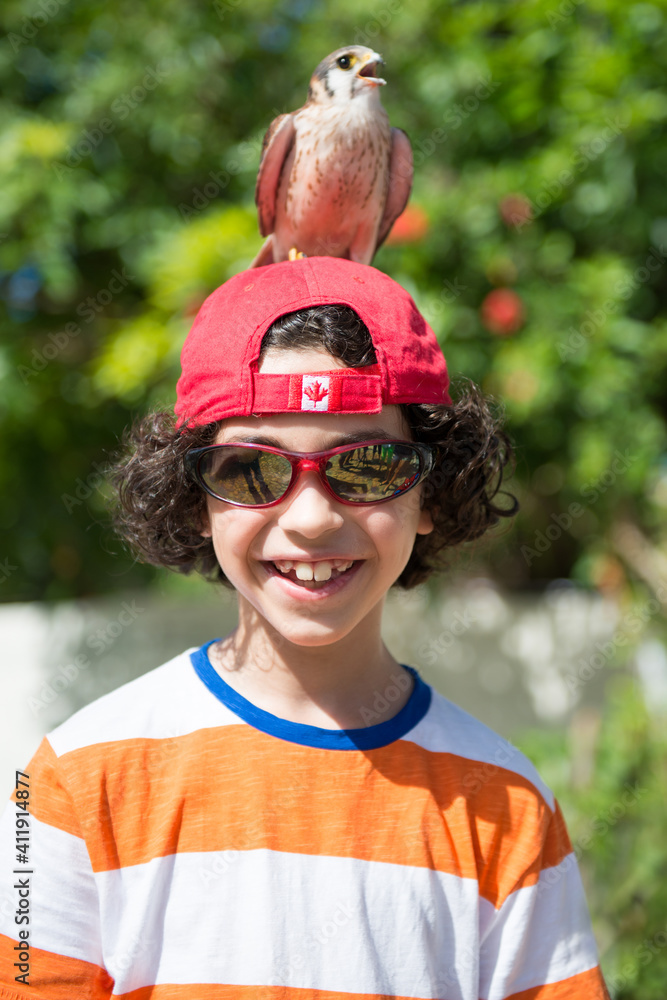 Canadian child tourist portrait with a bird in Manaca-Iznaga, Trinidad, Cuba Canadian child tourist portrait with a bird in Manaca-Iznaga, Trinidad, Cuba