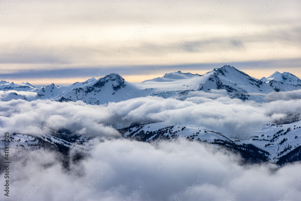 Whistler, British Columbia, Canada. Beautiful View of the Canadian Snow Covered Mountain Landscape during a cloudy and vibrant winter day.
