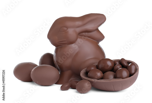 Chocolate Easter bunny and eggs on white background