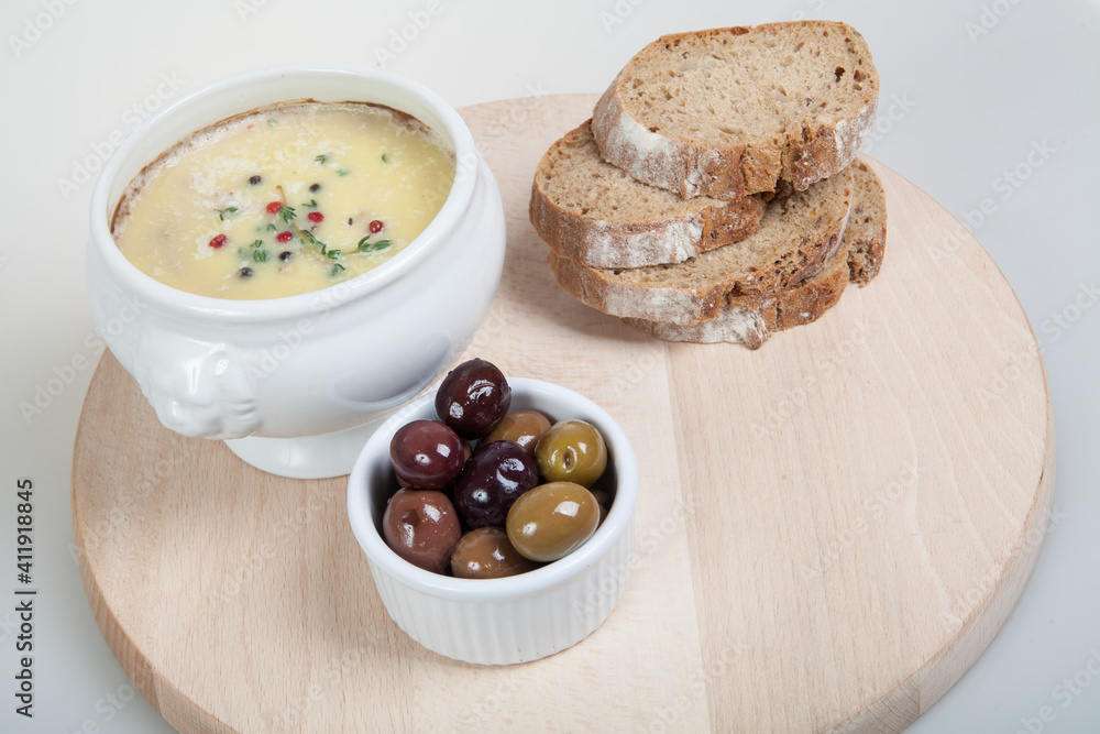 Homemade pate, olives and slices of bread on wooden board Homemade pate, olives and slices of bread on wooden board